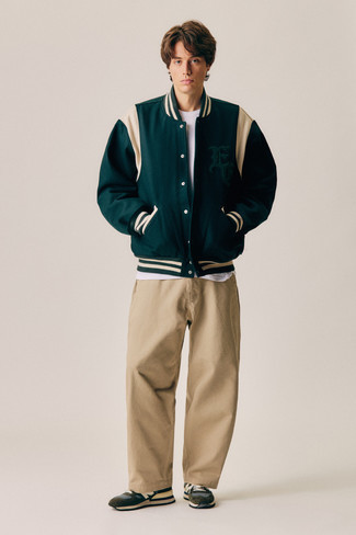 Dark Green Varsity Jacket Outfits For Men: Inject personality into your day-to-day casual repertoire with a dark green varsity jacket and khaki chinos. Want to play it down with shoes? Introduce dark brown athletic shoes to the equation for the day.