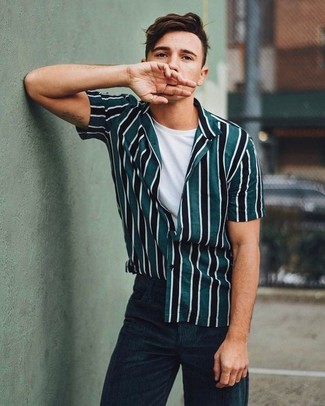 Dark Green Vertical Striped Short Sleeve Shirt Outfits For Men: If you love casual style, why not take this pairing of a dark green vertical striped short sleeve shirt and black corduroy jeans for a walk?