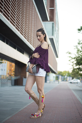 White Shorts Outfits For Women: A dark purple off shoulder top and white shorts worn together are a covetable combo for those who love relaxed styles. The whole outfit comes together really well if you complement this getup with a pair of tan leather knee high gladiator sandals.