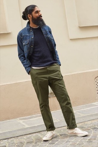 Navy Crew-neck Sweater Warm Weather Outfits For Men: Consider teaming a navy crew-neck sweater with olive cargo pants for a casual kind of refinement. Not sure how to finish? Complete your look with a pair of white canvas high top sneakers for a more casual twist.