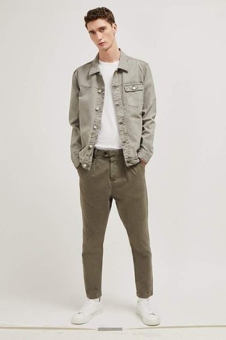 White and Black Canvas Low Top Sneakers Outfits For Men: Such pieces as a grey denim jacket and olive chinos are the perfect way to introduce effortless cool into your casual styling collection. White and black canvas low top sneakers are an easy way to add a confident kick to the outfit.