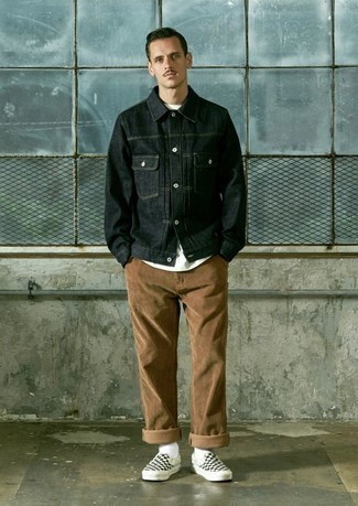 Black Denim Jacket Outfits For Men: Why not wear a black denim jacket with brown corduroy chinos? Both items are very practical and look good when paired together. Complete this look with a pair of black and white check canvas slip-on sneakers and the whole look will come together perfectly.