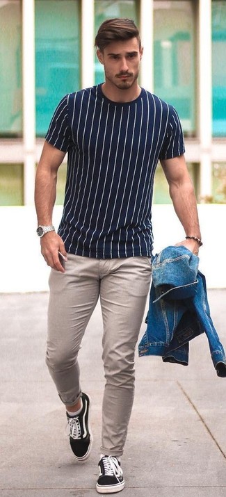 White and Navy Crew-neck T-shirt Outfits For Men: A white and navy crew-neck t-shirt and beige chinos are a nice pairing that will easily carry you throughout the day. Our favorite of an infinite number of ways to complement this outfit is with black canvas low top sneakers.