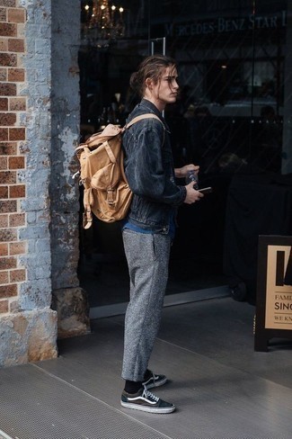Beige Canvas Backpack Outfits For Men: Opt for a charcoal denim jacket and a beige canvas backpack for a laid-back look with an edgy finish. A trendy pair of black and white canvas low top sneakers is an easy way to punch up your look.