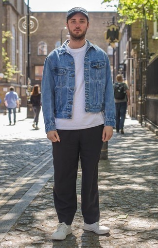 Blue Denim Jacket Outfits For Men: A blue denim jacket and black chinos are the kind of casual essentials that you can wear for years to come. Why not add white canvas low top sneakers to the mix for an air of stylish effortlessness?