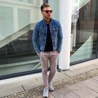 Blue Denim Jacket Outfits For Men: A blue denim jacket and pink chinos are the kind of a no-brainer casual getup that you so terribly need when you have zero time. Add light blue athletic shoes to your ensemble to change things up a bit.