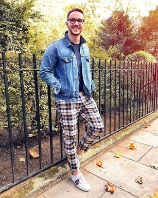 Multi colored Plaid Chinos Outfits: This casual combo of a blue denim jacket and multi colored plaid chinos is a solid bet when you need to look sharp but have zero time. Let your styling savvy truly shine by finishing your outfit with a pair of white print leather low top sneakers.