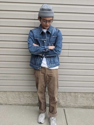 Brown Chinos Outfits: When the setting permits an off-duty look, opt for a blue denim jacket and brown chinos. To give your overall look a more laid-back twist, add a pair of white athletic shoes to your getup.