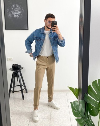 Blue Denim Jacket Outfits For Men: For a laid-back and cool ensemble, wear a blue denim jacket and khaki chinos — these pieces play perfectly well together. Infuse a more casual touch into this getup by rounding off with white leather low top sneakers.