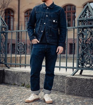 White Canvas Low Top Sneakers Outfits For Men: Channel your inner laid-back self and marry a navy denim jacket with navy jeans. A pair of white canvas low top sneakers looks wonderful here.