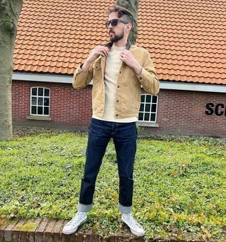 Beige Crew-neck T-shirt Outfits For Men: For an off-duty look, rock a beige crew-neck t-shirt with navy jeans — these two items go pretty good together. A trendy pair of white canvas high top sneakers is an effortless way to upgrade your ensemble.