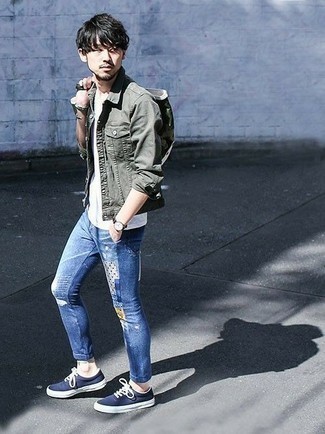 Blue Patchwork Jeans Outfits For Men: You'll be surprised at how easy it is for any gentleman to put together this laid-back look. Just an olive denim jacket and blue patchwork jeans. A pair of navy and white canvas low top sneakers is a nice option to finish your ensemble.