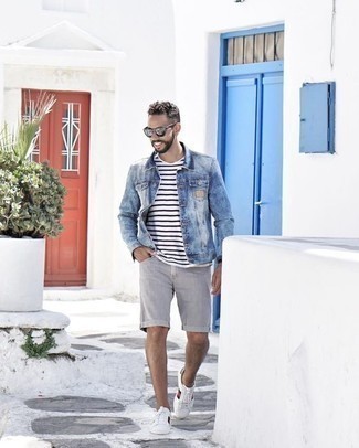 White and Black Crew-neck T-shirt with Denim Jacket Outfits For Men: If the setting allows a relaxed look, you can wear a denim jacket and a white and black crew-neck t-shirt. White print leather low top sneakers are a wonderful choice to finish this getup.