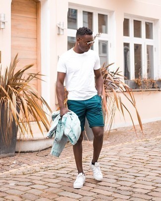 Teal Shorts Outfits For Men: You're looking at the undeniable proof that a light blue denim jacket and teal shorts look awesome when married together in a casual look. On the footwear front, this outfit is completed brilliantly with white canvas low top sneakers.