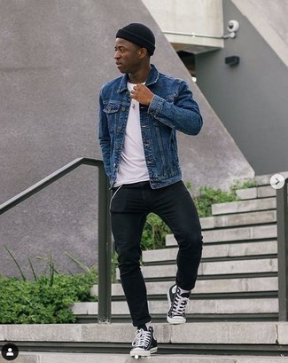 Black Skinny Jeans Outfits For Men: This combo of a navy denim jacket and black skinny jeans is an appealing idea for when it's time to clock off. Why not complete your outfit with black and white canvas high top sneakers for a playful feel?