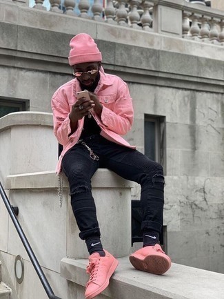 Pink Denim Jacket Outfits For Men: Marry a pink denim jacket with black ripped skinny jeans if you want to look casually stylish without exerting much effort. Take a more refined approach with shoes and complement your ensemble with pink leather low top sneakers.