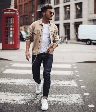 Beige Denim Jacket Outfits For Men: This pairing of a beige denim jacket and navy skinny jeans combines comfort and utility and helps keep it low profile yet modern. If you don't know how to finish off, a pair of white canvas low top sneakers is a safe option.