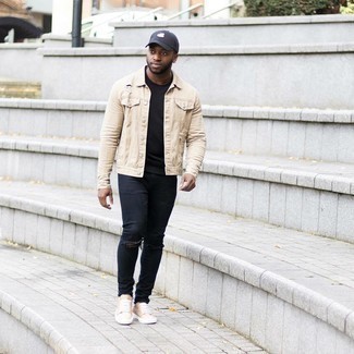 Beige Denim Jacket Outfits For Men: If you're a fan of comfort dressing, why not consider this combo of a beige denim jacket and black ripped skinny jeans? You could perhaps get a little creative in the shoe department and round off with tan canvas low top sneakers.