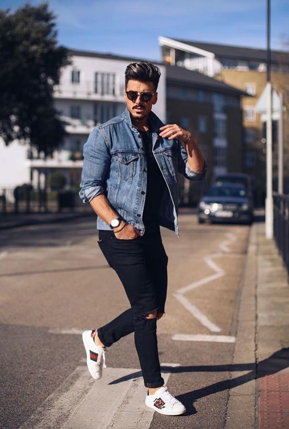 ripped black jeans, a white tee, a blue denim jacket and grey