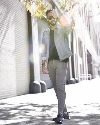Grey Denim Jacket Outfits For Men: This pairing of a grey denim jacket and grey sweatpants is uber stylish and provides instant off-duty cool. Feeling transgressive? Shake up this outfit by rocking black and white athletic shoes.