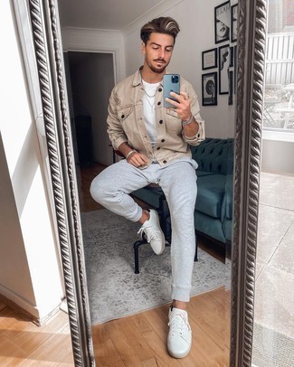 Beige Denim Jacket Outfits For Men: This combination of a beige denim jacket and grey sweatpants is put together and yet it's casual and apt for anything. Add a pair of white and black leather low top sneakers to the equation to pull your full look together.