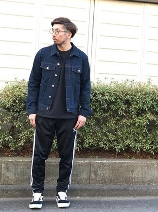 Black and White Canvas Low Top Sneakers Outfits For Men: You'll be surprised at how easy it is for any gentleman to get dressed like this. Just a navy denim jacket paired with black sweatpants. If you're not sure how to round off, complete this outfit with black and white canvas low top sneakers.