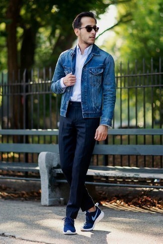 Navy Vertical Striped Dress Pants Outfits For Men: For a casually sleek ensemble, rock a blue denim jacket with navy vertical striped dress pants — these two items fit pretty good together. A good pair of blue athletic shoes is the most effective way to upgrade this ensemble.