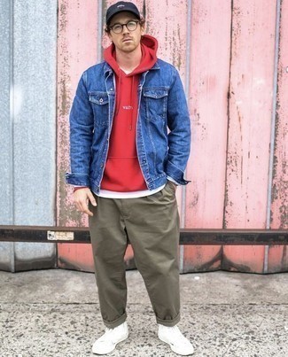 Premium Photo  Goodlooking young man with hairstyle with stylish blue denim  jacket in pink fashionable sweatshirt near white wall in city glamour  urban sweet guy in beautiful trendy casual wear walks