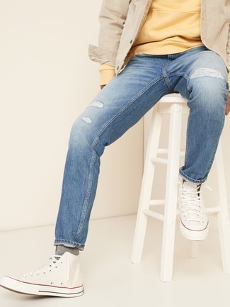Blue Ripped Jeans Outfits For Men: Marry a beige denim jacket with blue ripped jeans for a casual street style ensemble that's also easy to wear. Add white canvas high top sneakers to the mix and the whole ensemble will come together perfectly.