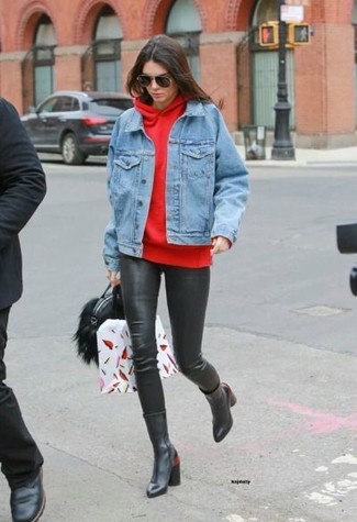 Kendall Jenner wearing Light Blue Denim Jacket, Red Hoodie, Black Leather Leggings, Black Leather Mid-Calf Boots