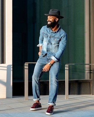 Blue Denim Jacket with Blue Jeans Summer Outfits For Men: This casual and cool look is really pared down: a blue denim jacket and blue jeans. Burgundy leather low top sneakers look great rounding off your getup. If you're thinking of a summer-ready look, this here is your inspiration.