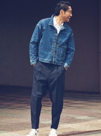 Blue Denim Jacket Outfits For Men: You're looking at the irrefutable proof that a blue denim jacket and black chinos are awesome when teamed together in a relaxed menswear style. Bring casualness to your getup by slipping into a pair of white star print leather low top sneakers.