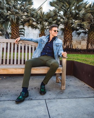 Olive Jeans Outfits For Men: This pairing of a light blue denim jacket and olive jeans resonates casual cool and stylish comfort. Finishing off with a pair of dark green leather loafers is a fail-safe way to bring a sense of elegance to this ensemble.
