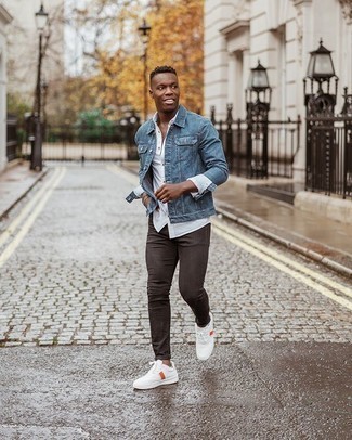 Tobacco Jeans Outfits For Men: To create a casual ensemble with a modern take, make a blue denim jacket and tobacco jeans your outfit choice. Introduce a pair of white print canvas low top sneakers to the mix and the whole look will come together really well.