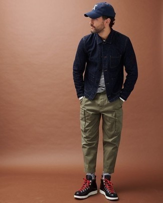 Black Leather Work Boots Outfits For Men: This pairing of a navy denim jacket and olive cargo pants makes for the ultimate relaxed casual outfit for any modern gent. Black leather work boots are a guaranteed way to bring a dose of stylish nonchalance to this look.