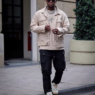 Beige Print Long Sleeve T-Shirt Outfits For Men: To achieve a relaxed menswear style with a modern spin, make a beige print long sleeve t-shirt and navy cargo pants your outfit choice. Turn up the dressiness of this ensemble a bit by rocking white canvas low top sneakers.