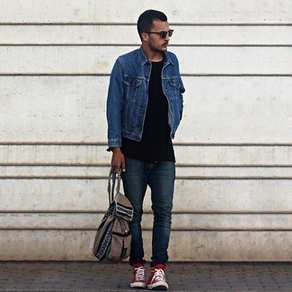 Brown Canvas Backpack Outfits For Men: Pair a blue denim jacket with a brown canvas backpack for a killer and trendy ensemble. Spice up your ensemble with a dressier kind of footwear, like this pair of red canvas high top sneakers.