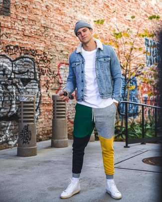 White and Red Leather High Top Sneakers Outfits For Men: If you appreciate comfortable style, marry a blue denim jacket with multi colored sweatpants. Grab a pair of white and red leather high top sneakers to instantly ramp up the street cred of your look.