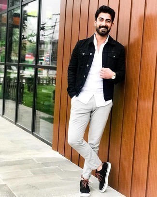 Beige Leather Watch Outfits For Men: We all want comfort when it comes to styling, and this edgy combo of a black denim jacket and a beige leather watch is a practical example of that. For a more refined spin, why not add black canvas low top sneakers to the mix?