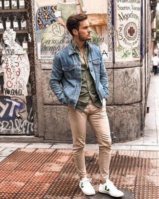 Blue Denim Jacket Outfits For Men: Pair a blue denim jacket with khaki chinos to don a casual and cool ensemble. Go the extra mile and shake up your look by rocking a pair of white and green leather low top sneakers.