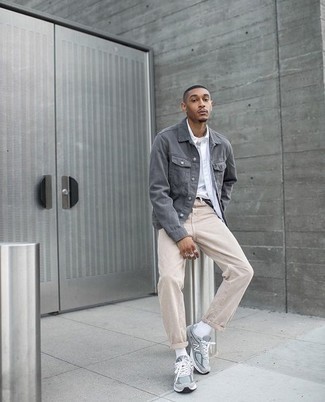 Beige Jeans Outfits For Men: This off-duty combo of a grey denim jacket and beige jeans is extremely easy to pull together without a second thought, helping you look on-trend and ready for anything without spending too much time digging through your wardrobe. Grey athletic shoes will bring an easy-going touch to an otherwise classic look.