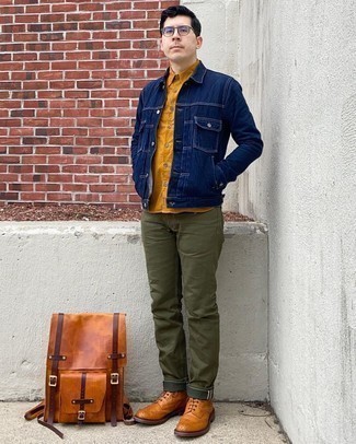 Olive Jeans Outfits For Men: Go for a pared down yet casually cool option by pairing a navy denim jacket and olive jeans. And if you need to instantly kick up this ensemble with a pair of shoes, why not complement this look with a pair of tobacco leather brogue boots?