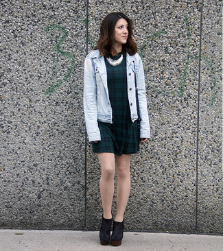 Consider pairing a light blue denim jacket with a dark green plaid skater dress if you want to look cool and casual without putting in too much effort. Let your sartorial savvy really shine by finishing off this ensemble with black suede ankle boots.