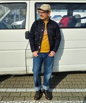 Yellow Sweatshirt Outfits For Men: Go for a yellow sweatshirt and navy ripped jeans to pull together a casual and comfortable ensemble. Rounding off with a pair of dark brown leather casual boots is a guaranteed way to inject a dose of elegance into your outfit.