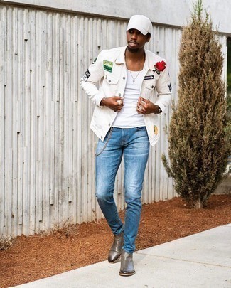 Olive Leather Chelsea Boots Outfits For Men: Go for casual street style in a white embroidered denim jacket and blue skinny jeans. For extra fashion points, complete your ensemble with a pair of olive leather chelsea boots.