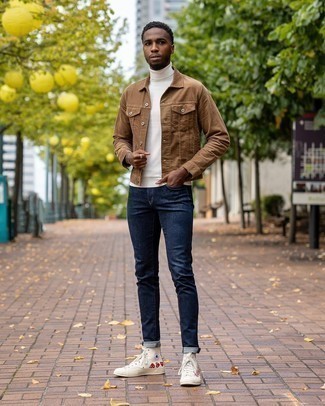 Tobacco Denim Jacket Outfits For Men: Dress in a tobacco denim jacket and navy jeans to put together a laid-back and cool getup. And if you need to immediately dial down your outfit with footwear, why not complete this look with a pair of beige print canvas high top sneakers?