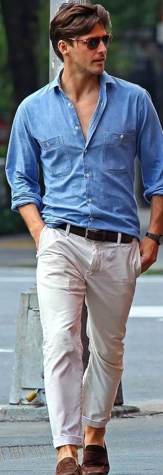 Light Blue Denim Shirt Outfits For Men: This combination of a light blue denim shirt and beige chinos looks amazing and makes you look infinitely cooler. In the shoe department, go for something on the smarter end of the spectrum and round off your look with a pair of dark brown suede loafers.