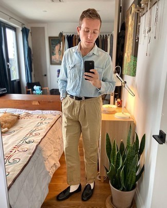 Light Blue Denim Shirt Outfits For Men: A light blue denim shirt and khaki chinos are the perfect base for a cool and casual getup. Let your styling credentials truly shine by finishing your outfit with black leather loafers.