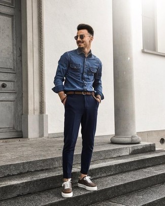 Dark Brown Canvas Low Top Sneakers Outfits For Men: If you're on the hunt for a laid-back and at the same time dapper outfit, try teaming a blue denim shirt with navy chinos. If you're clueless about how to round off, a pair of dark brown canvas low top sneakers is a good choice.