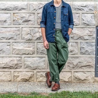 Navy Denim Shirt Outfits For Men: A navy denim shirt and dark green chinos are a great combo worth integrating into your current lineup. For extra style points, add brown leather desert boots to the mix.